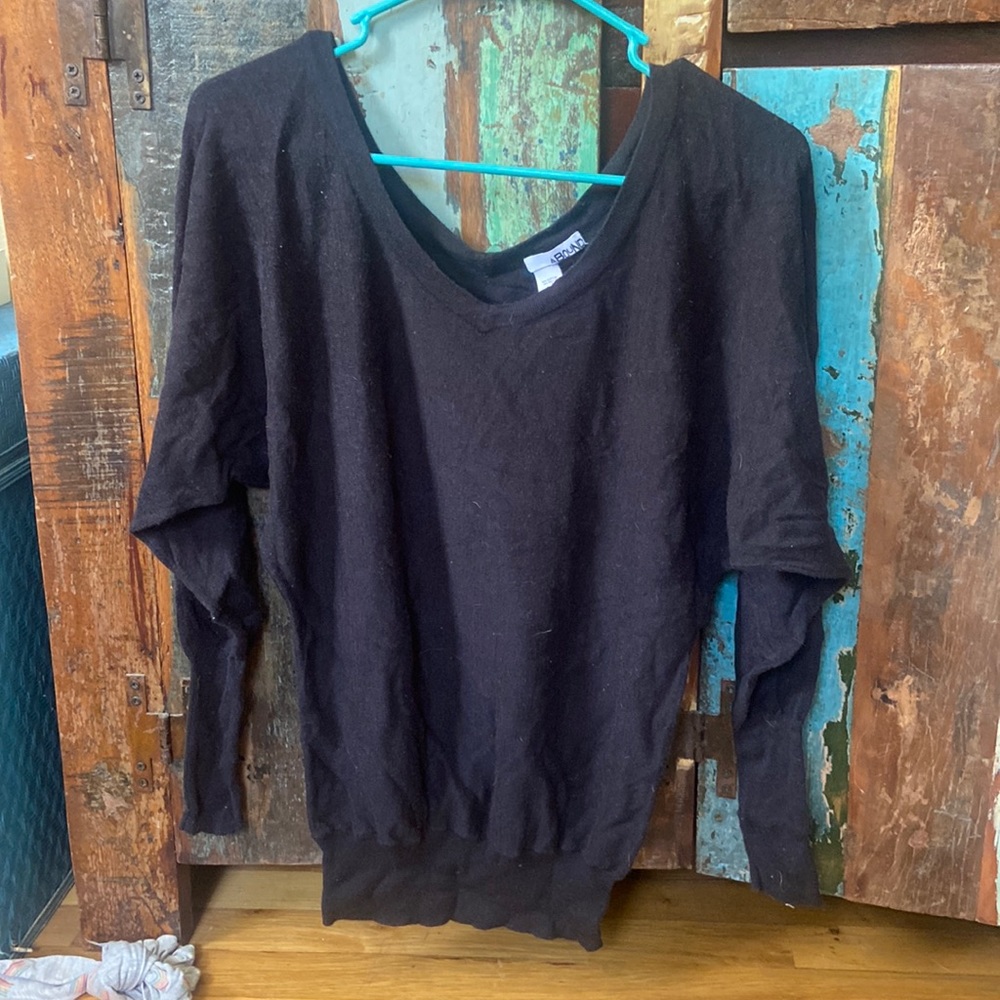 black cardigan, sinched at the bottom